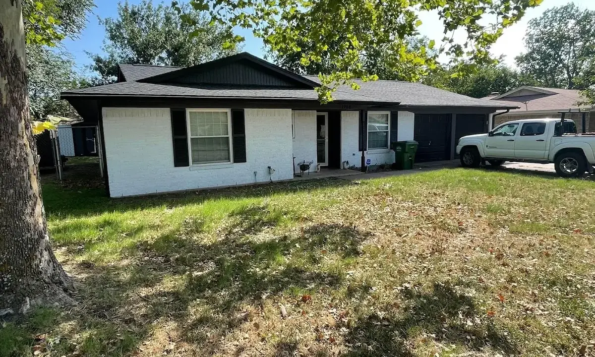Professional roofing crew working on a residential roof in Placentia